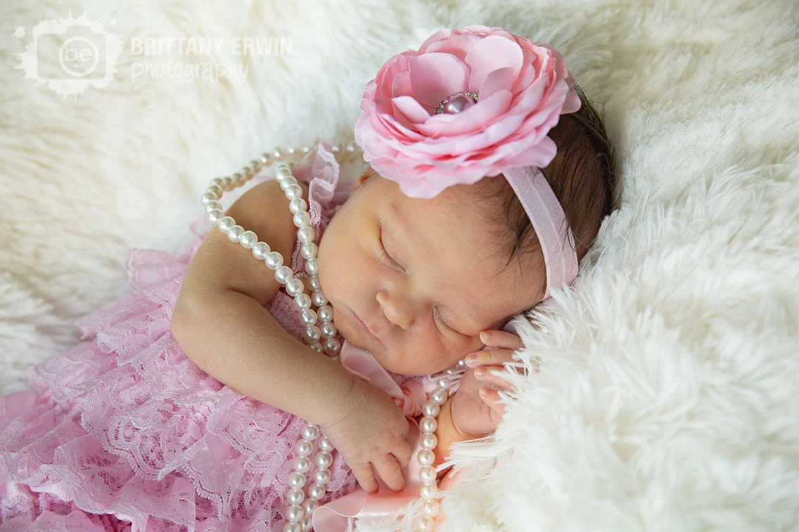 Indianapolis-lifestyle-portrait-photographer-newborn-baby-girl-flower-headband-pink-romper.jpg