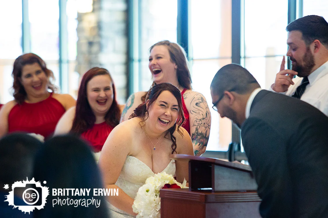 Bride-reaction-husband-wife-ceremony-photographer-sycamore-at-mallow-run-winery-laughing-bridesmaids.jpg