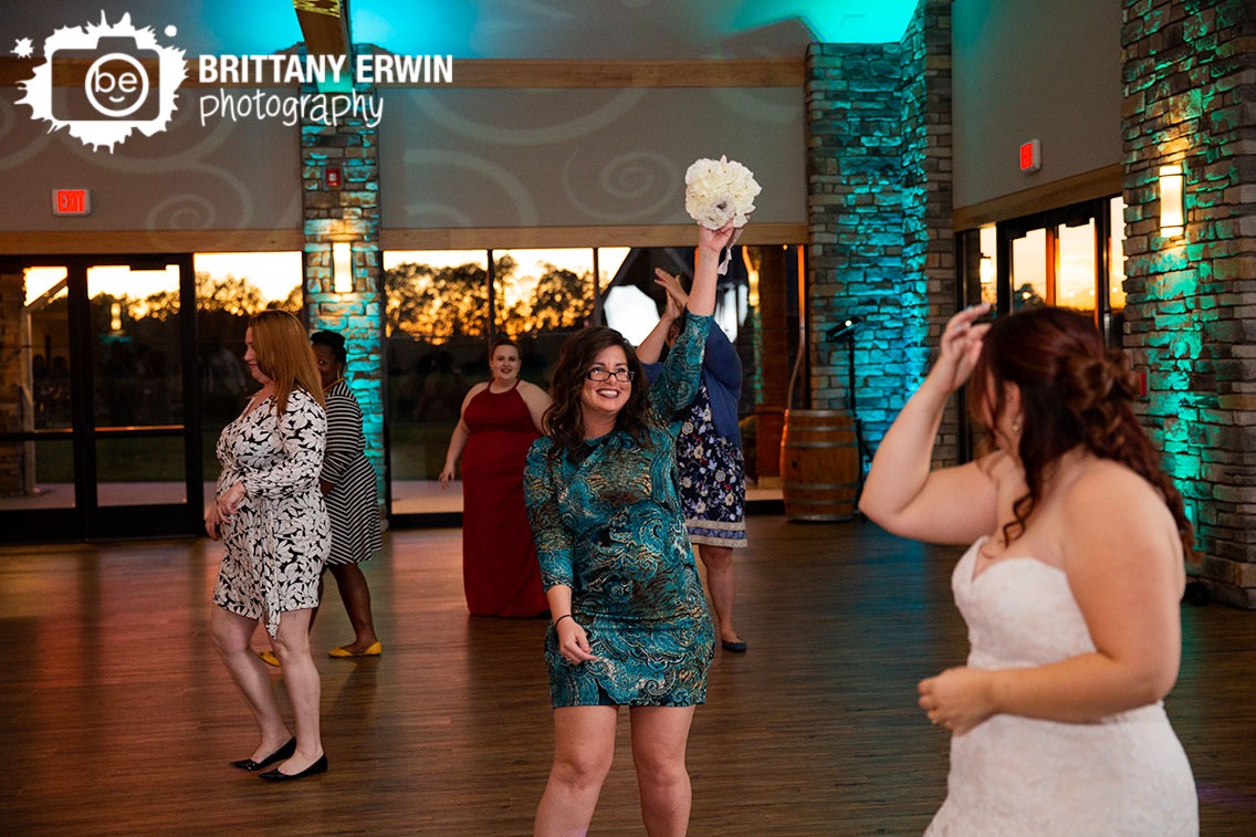 Sycamore-at-Mallow-Run-reception-photographer-bouquet-toss-caught.jpg