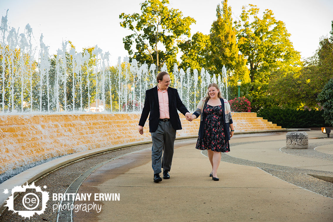 Bloomington-Indiana-couple-walking-next-to-fountain-engagement-portrait-photographer.jpg