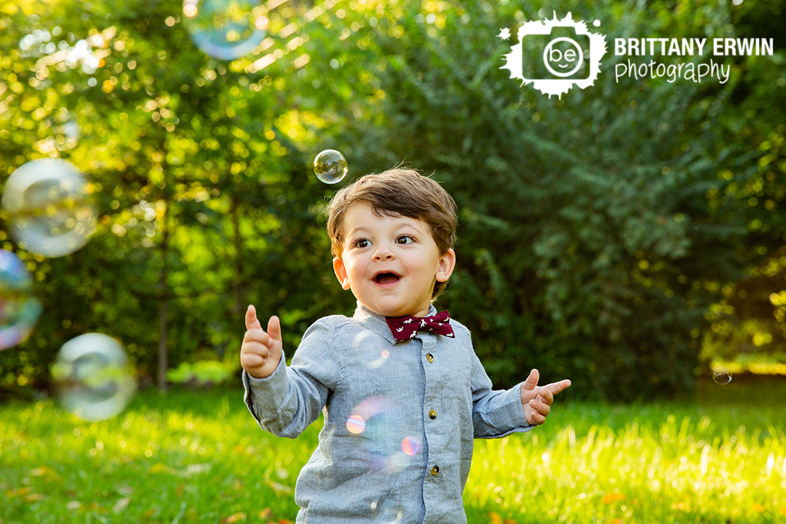 Indianapolis-fall-portrait-photographer-toddler-boy-outside-playing-with-bubbles.jpg