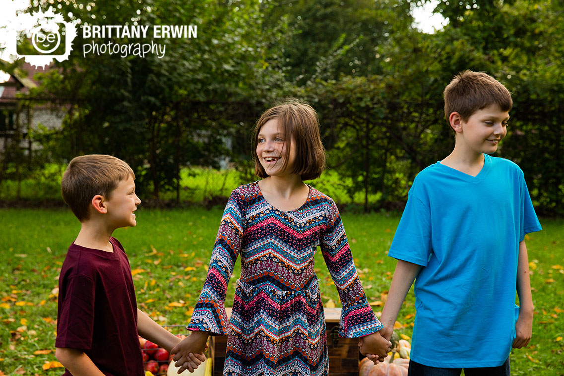 Indianapolis-fall-portrait-photographer-siblings-brothers-sister-walking-outside.jpg