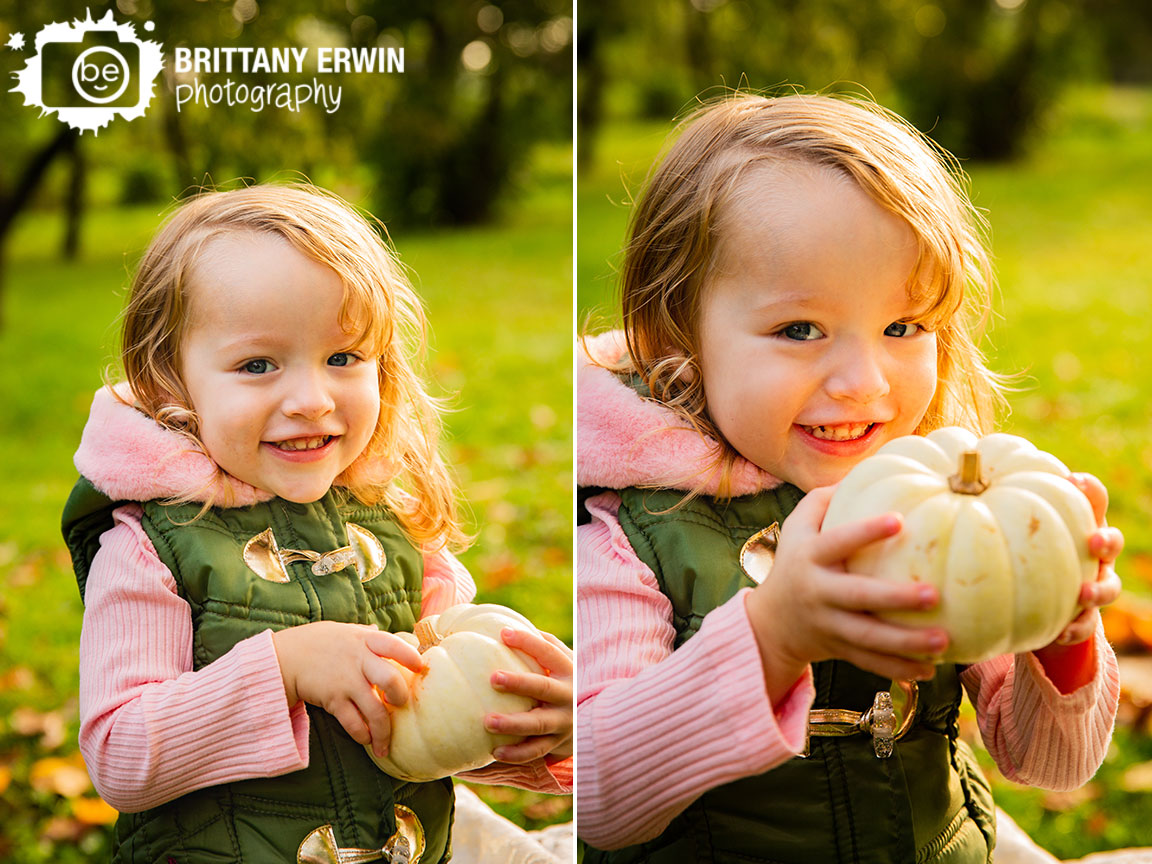 Indianapolis-fall-portrait-photographer-vest-pumpkin-toddler-girl-outdoor.jpg