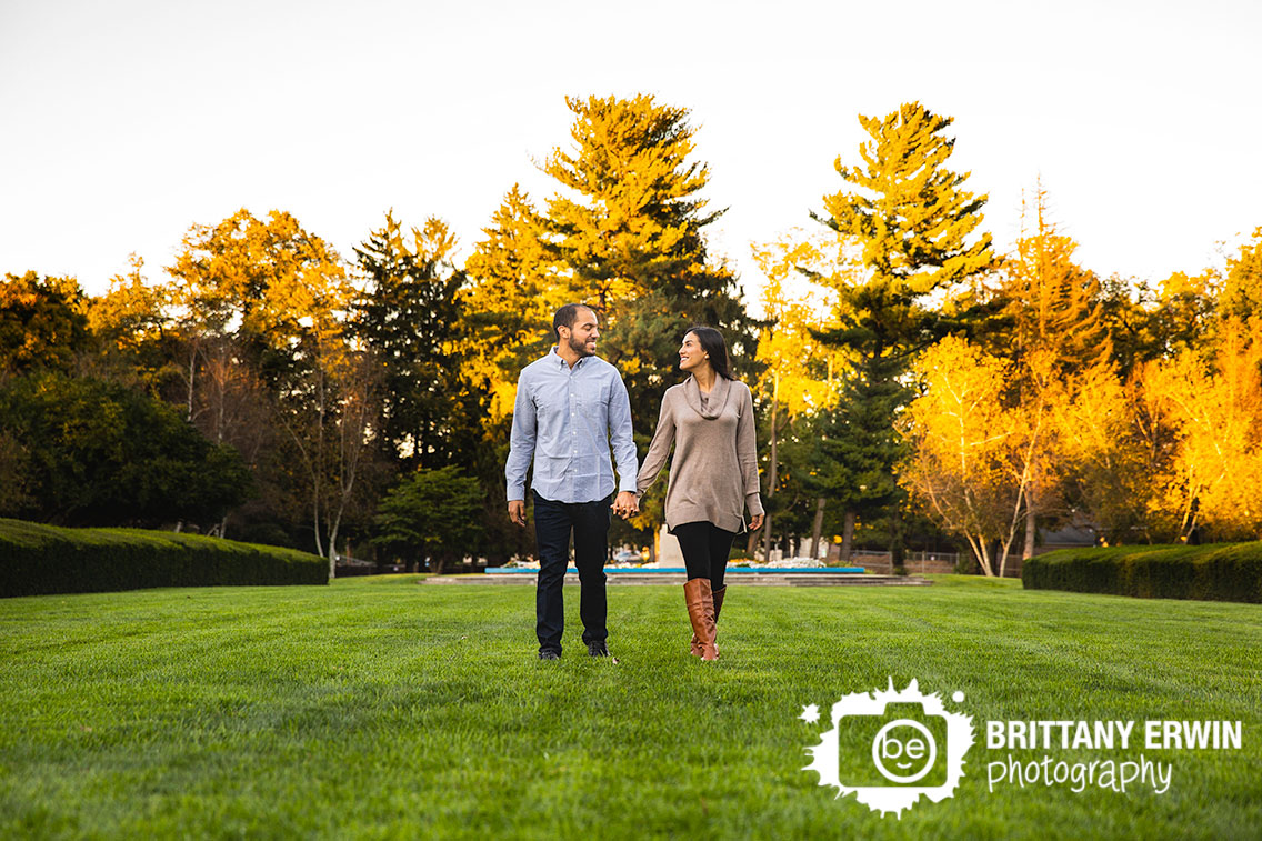 Autumn-leaves-outdoor-engagement-portrait-photographer-couple-walking.jpg