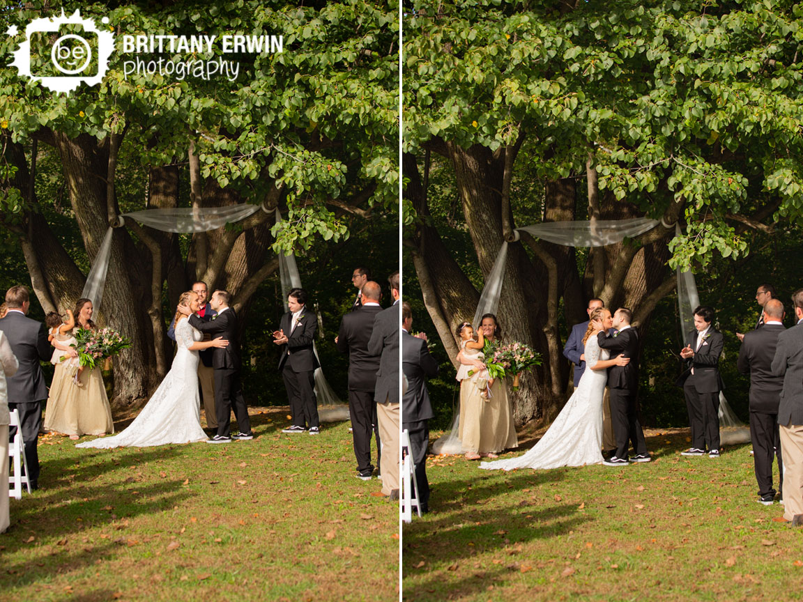 Wea-Creek-Orchard-wedding-tree-ceremony-first-kiss-cheer.jpg