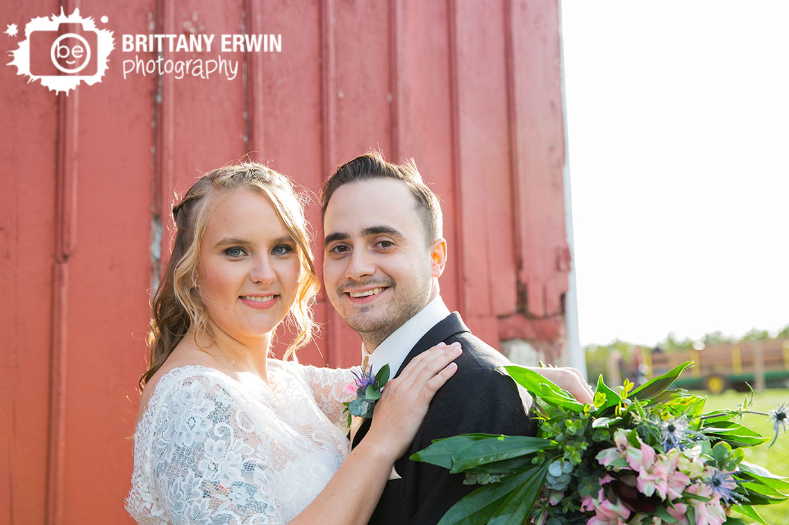 Wea-Creek-Orchard-bridal-portrait-couple-outside-red-painted-barn-whole-foods-florist-bouquet.jpg