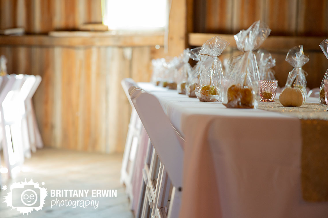 wea-creek-orchard-wedding-venue-barn-white-folding-chairs-caramel-apple-thank-you-favors.jpg