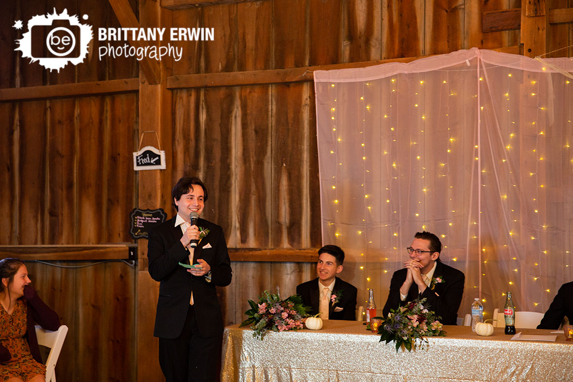 Wea-Creek-Orchard-wedding-photographer-best-man-toast-indoor-barn-venue.jpg