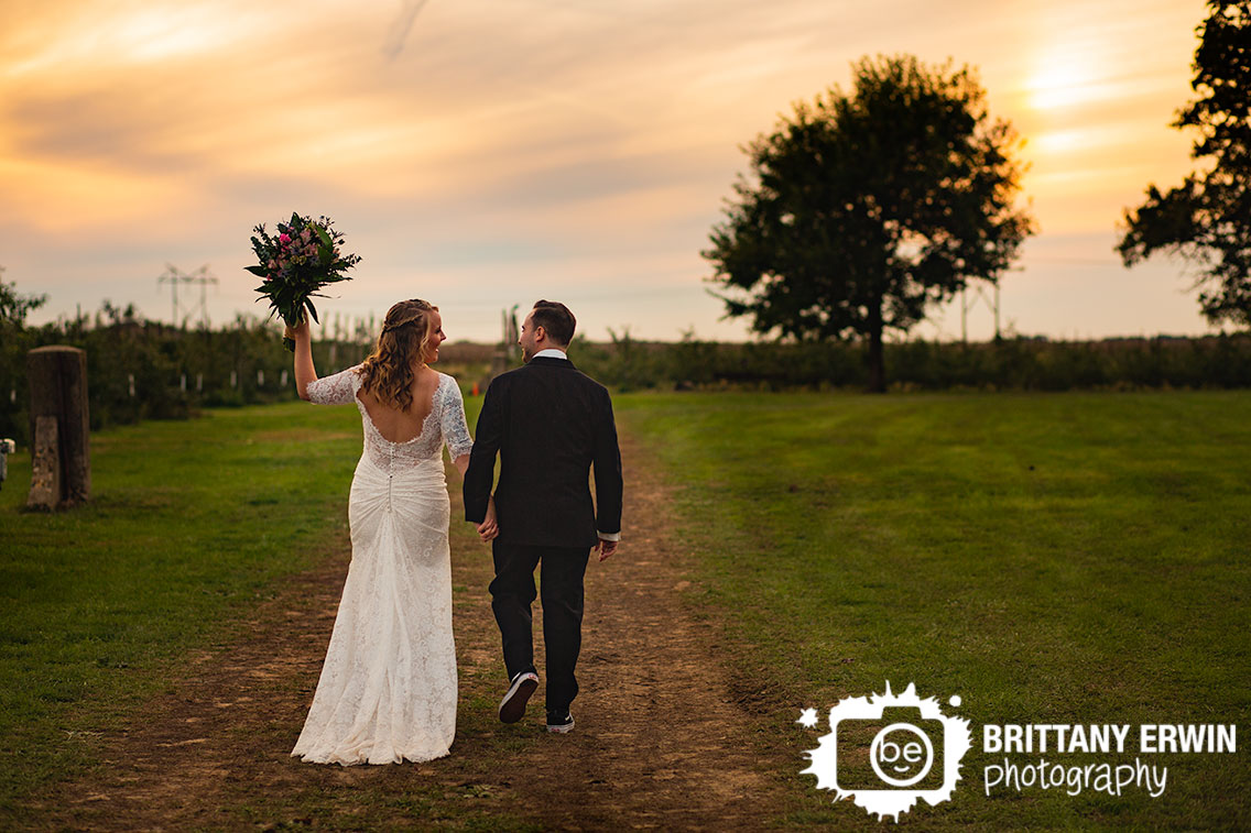 Wea-Creek-Orchard-lafayette-Indiana-wedding-photographer-couple-walk-into-sunset.jpg