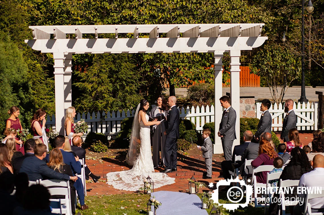 Historic-Ambassador-House-wedding-photographer-ceremony-bride-reading-vows-bridesmaid-reaction.jpg
