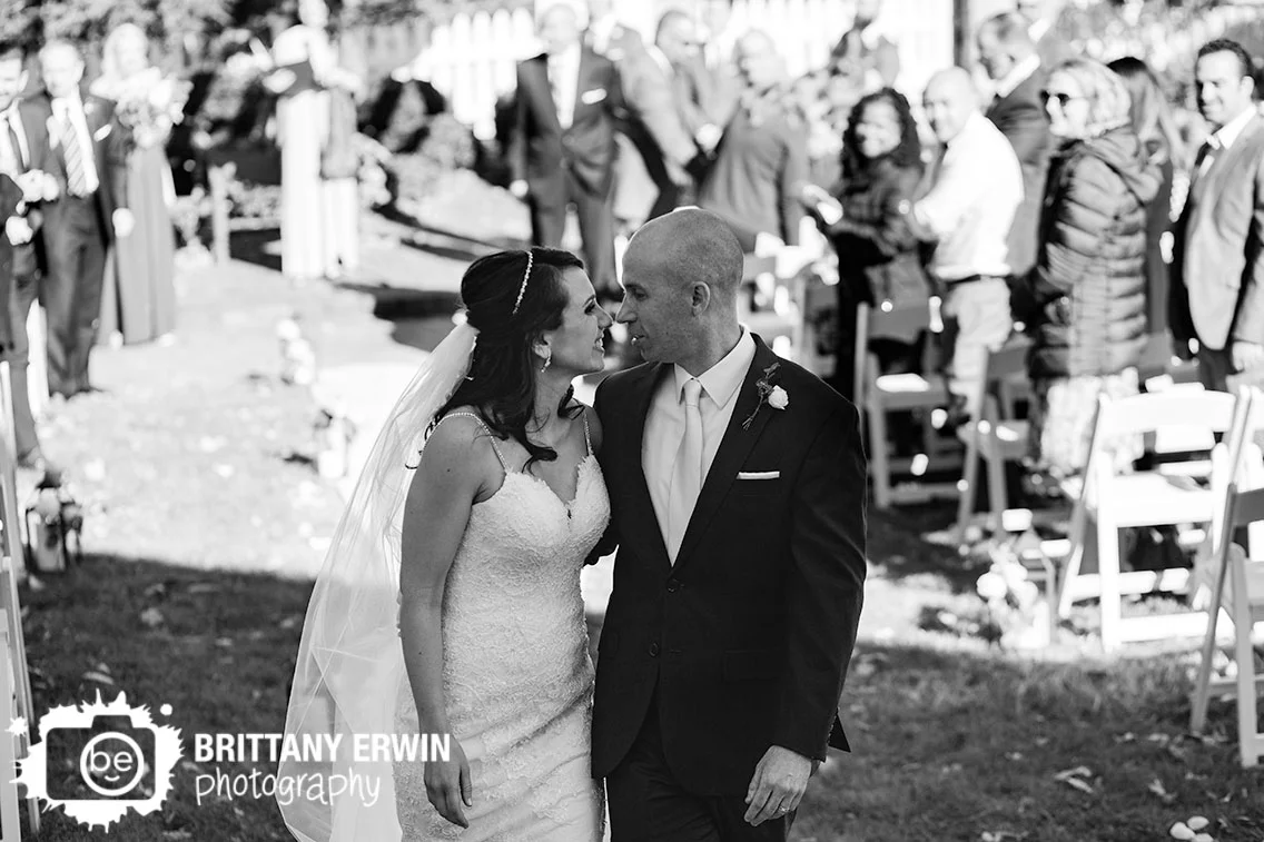 Bride-groom-kiss-after-walking-down-aisle-announced-husband-and-wife.jpg