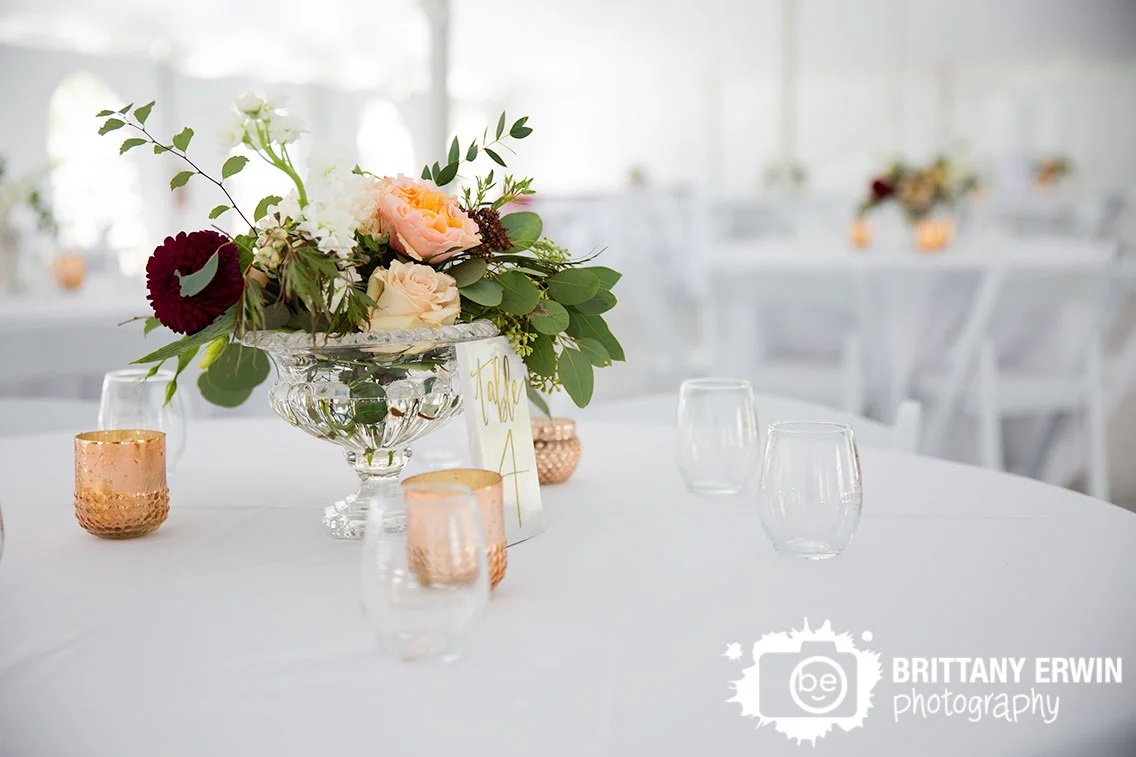 Molly-and-Myrtle-wedding-florist-centerpiece-gold-table-number-tea-light-flower-arrangement.jpg
