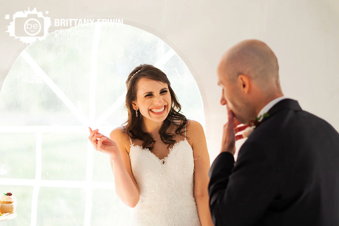 Historic-Ambassador-House-wedding-photographer-bride-reaction-cake-cutting.jpg