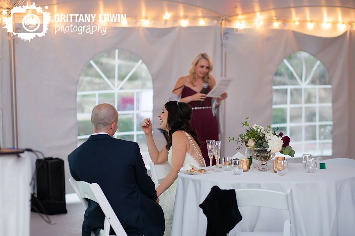 Fishers-Indiana-wedding-photographer-bride-laughing-toast-by-maid-of-honor.jpg