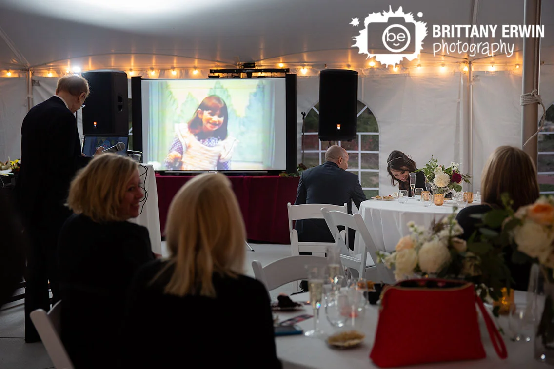 Historic-Ambassador-House-wedding-photography-couple-laugh-at-table-toast-by-father-of-bride.jpg