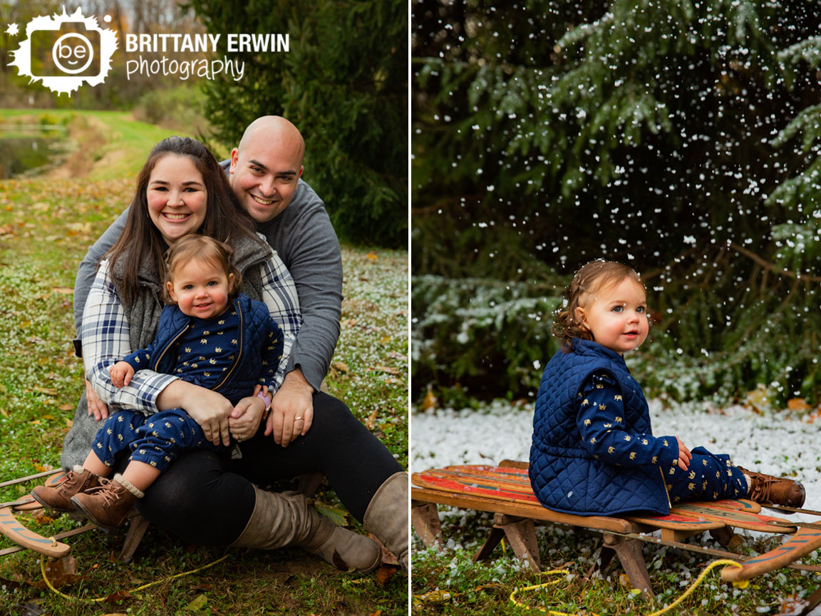 Family-portrait-photographer-group-on-antique-sled-snowing-toddler-elephant-blue-vest.jpg