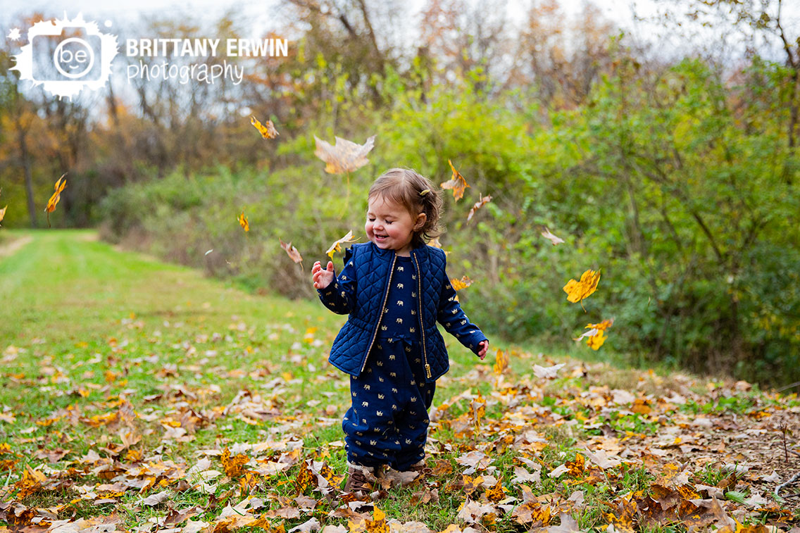 Camby-Indiana-portrait-photographer-blue-vest-toddler-elephant-romper-leaves-throw.jpg