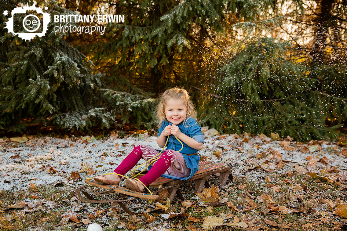 Indianapolis-snow-mini-session-little-girl-riding-antique-sled.jpg