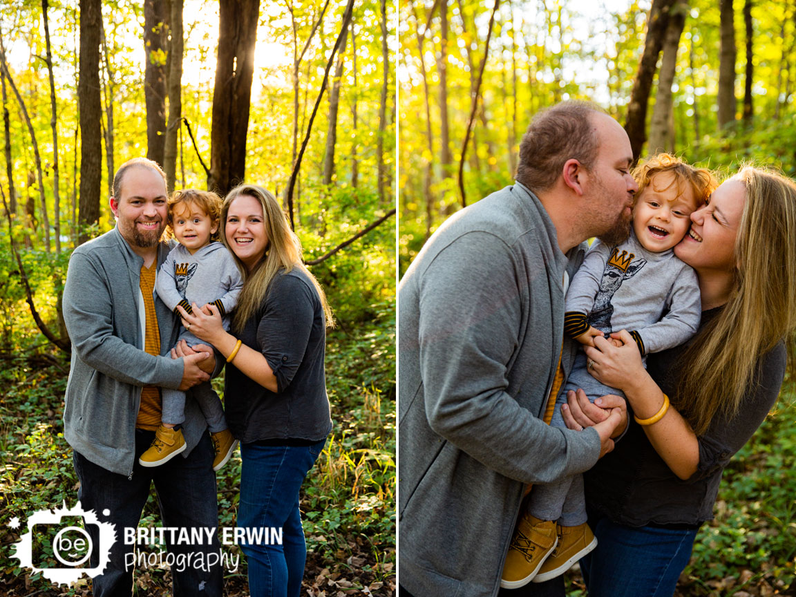 Fall-Indiana-leaves-family-portrait-cheek-kiss-toddler-boy-couple-on-path.jpg