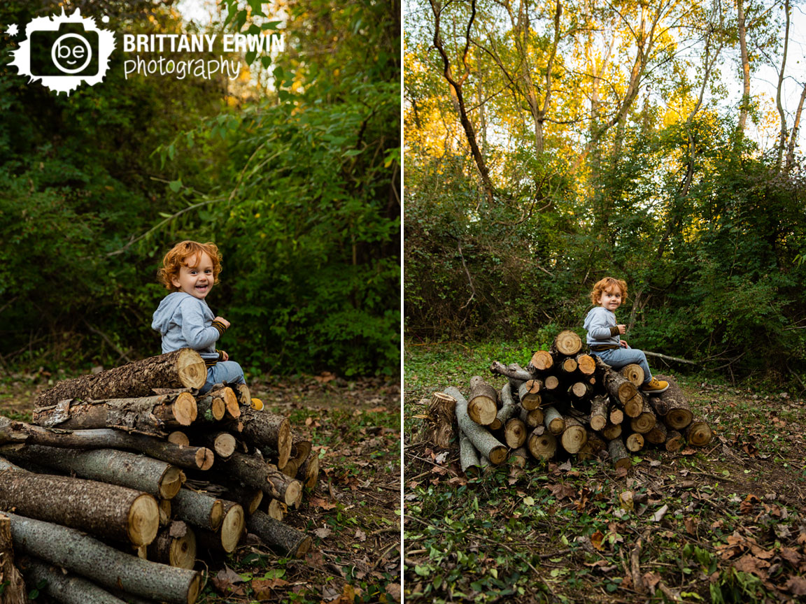 Indianapolis-fall-toddler-boy-portrait-photographer-laughing-sitting-on-firewood-logs.jpg