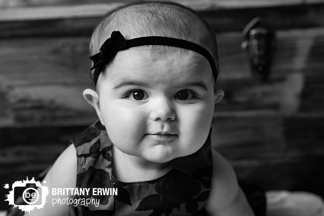Baby-girl-portrait-headband-with-dress-reclaimed-wood-wall.jpg