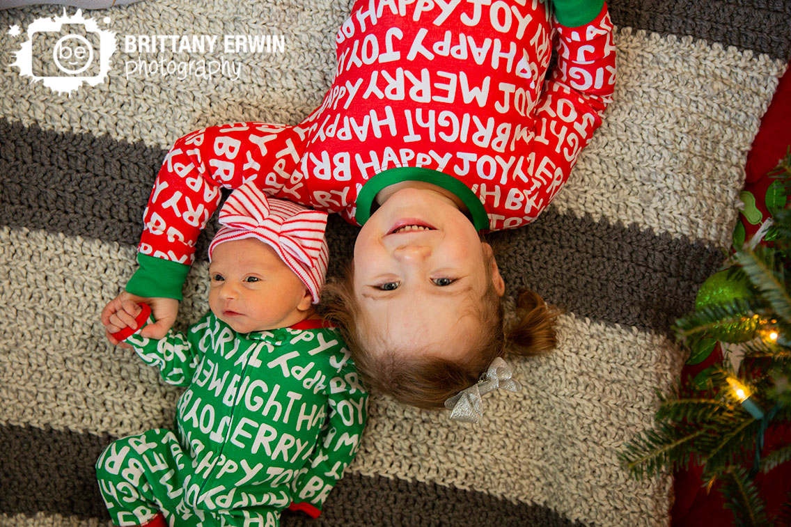 Indiana-newborn-in-home-lifestyle-siblings-sisters-matching-christmas-pajamas.jpg