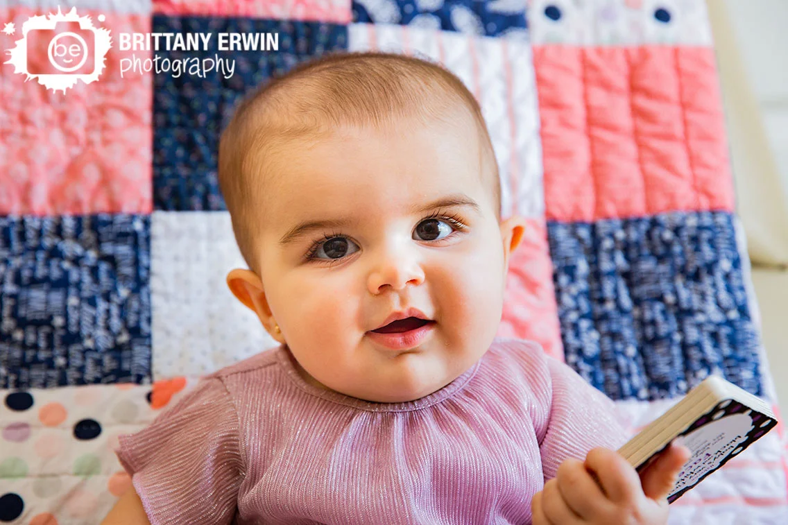 Indianapolis-lifestyle-photographer-baby-girl-sitting-in-chair-quilt-back-near-window.jpg