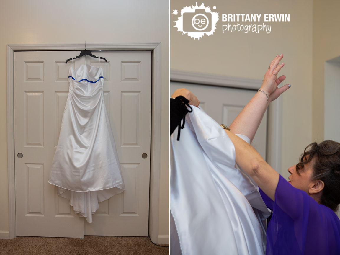 Indianapolis-wedding-photographer-dress-hanging-in-front-of-white-doors-bride-arms-up.jpg