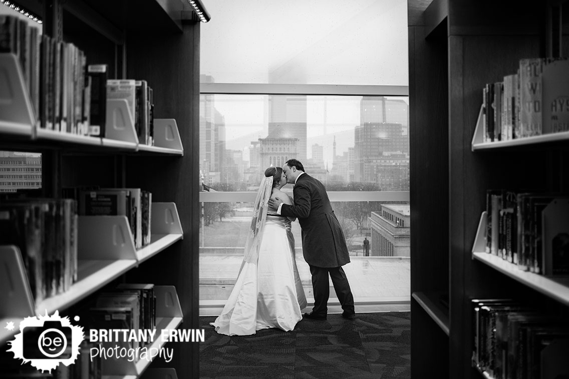 Indianapolis-couple-kiss-with-skyline-central-library-book-shelves.jpg