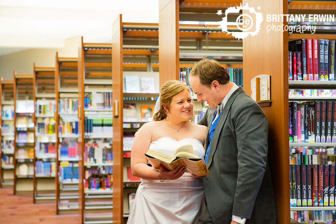 Indianapolis-central-library-couple-reading-book-together-between-bookshelves-aisle.jpg