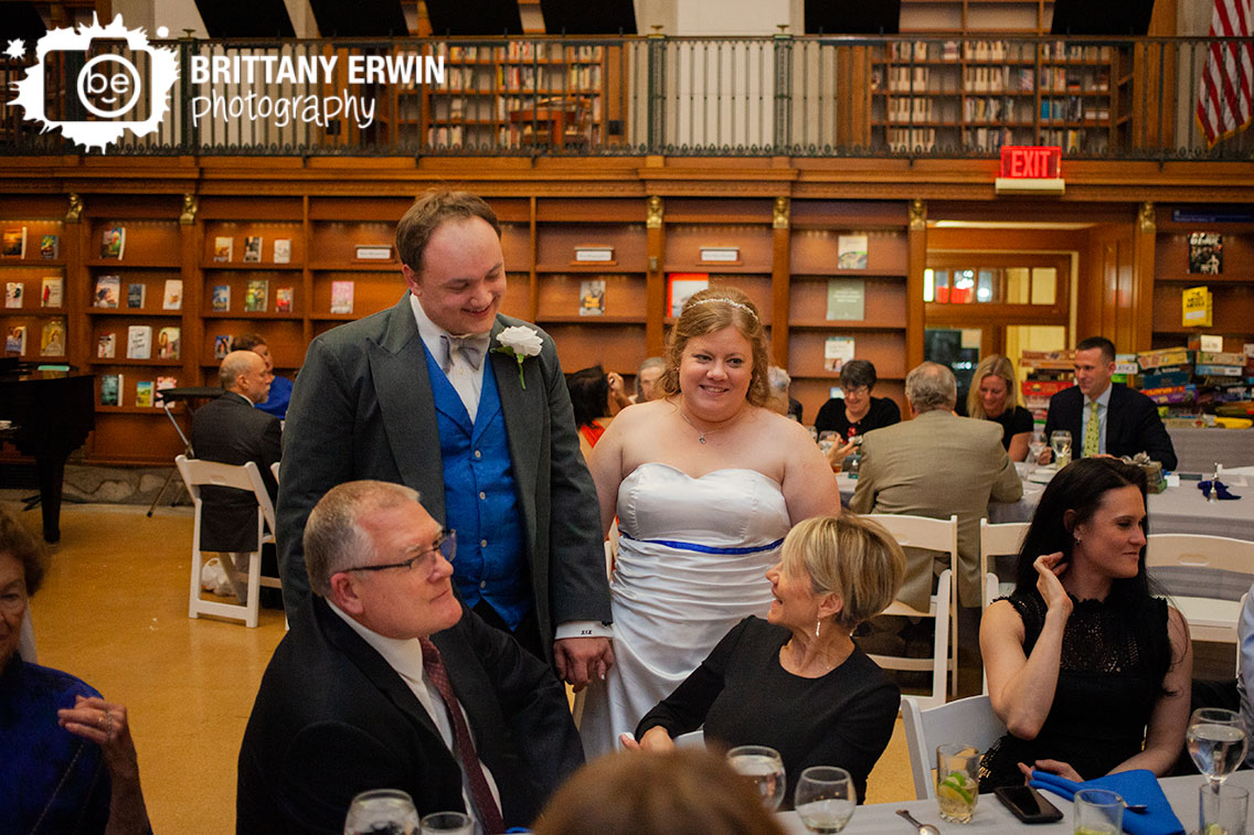 Indianapolis-wedding-photographer-couple-visit-tables-at-central-library-reception.jpg