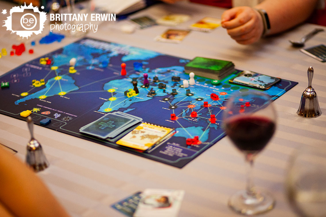 Indianapolis-wedding-photographer-central-library-nerdy-reception-playing-board-game-pandemic.jpg
