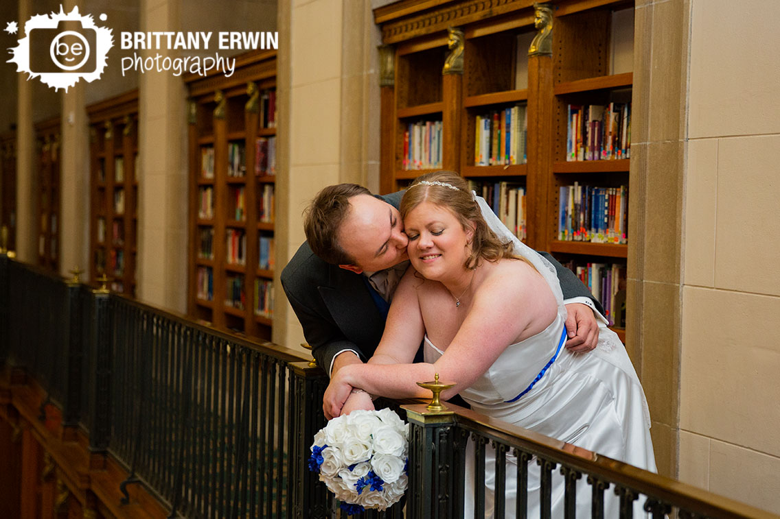 Indianapolis-central-library-wedding-photographer-couple-with-book-shelves-railing.jpg
