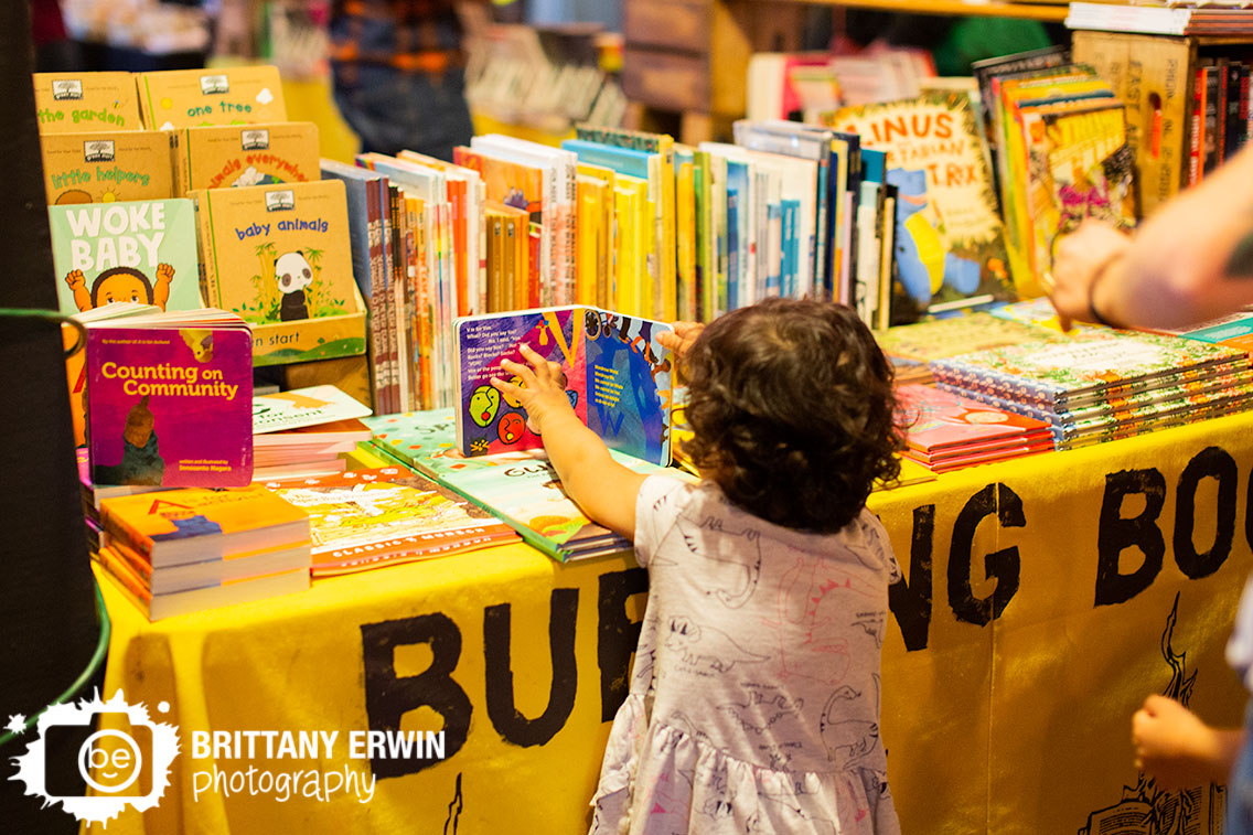 Burning-Books-display-table-Indy-VegFest-woke-baby-girl-reading-books.jpg