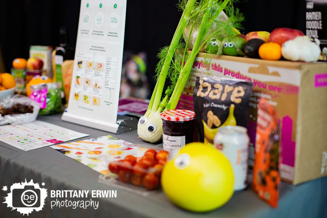 Indy-VegFest-booth-Imperfect-Produce-googly-eyes-on-vegetables-orange-preserves.jpg