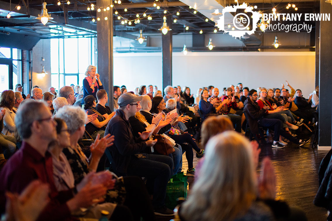 Indianapolis-event-Indy-VegFest-speaker-announced-walking-up-to-podium.jpg