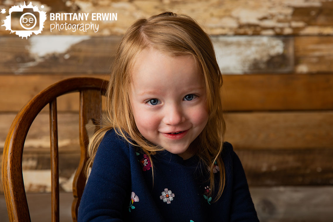 Indianapolis-studio-photographer-toddler-rocking-chair-antique-rustic-barn-wood-wall.jpg