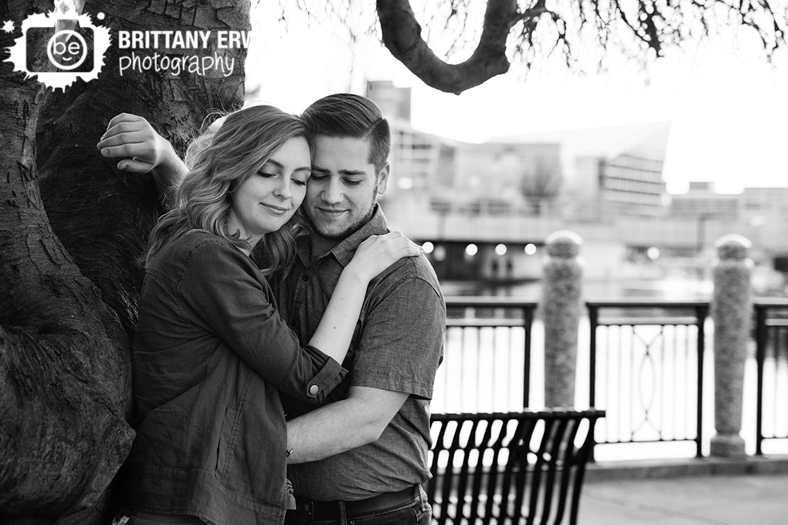 Indianapolis-engagement-portrait-photographer-couple-lean-on-tree-at-the-canal.jpg