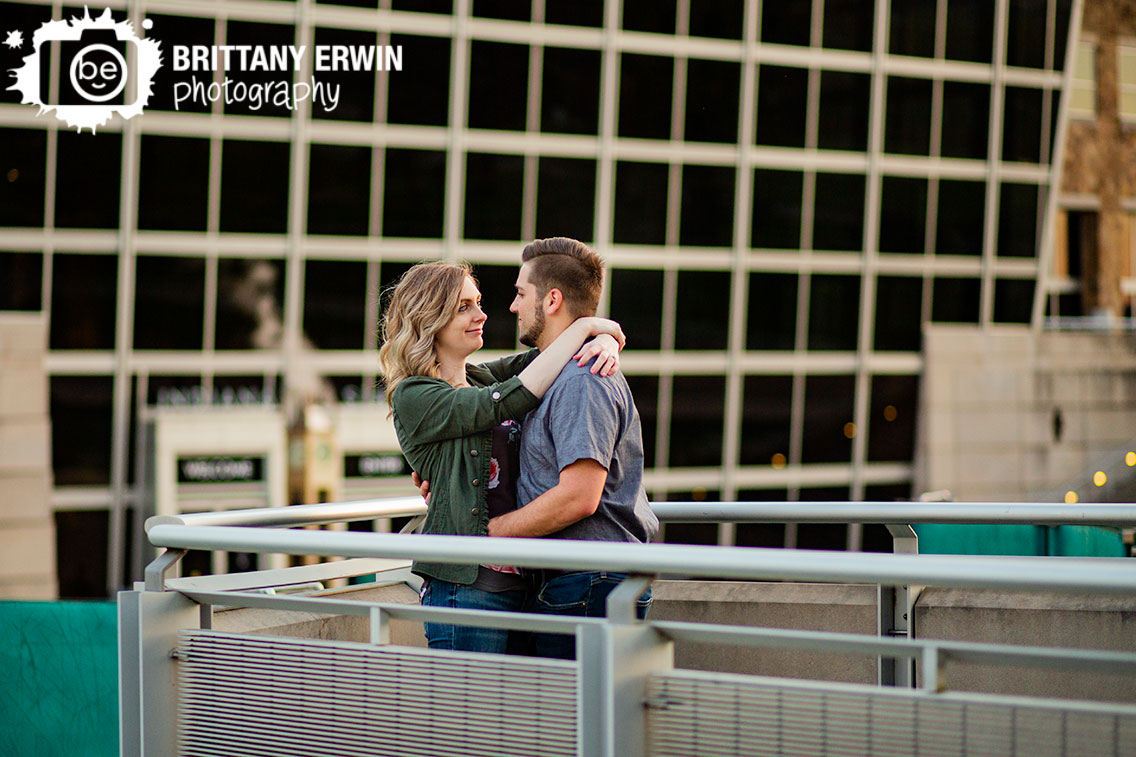 Indiana-State-museum-canal-side-engagement-photographer-couple-lean-on-rail.jpg