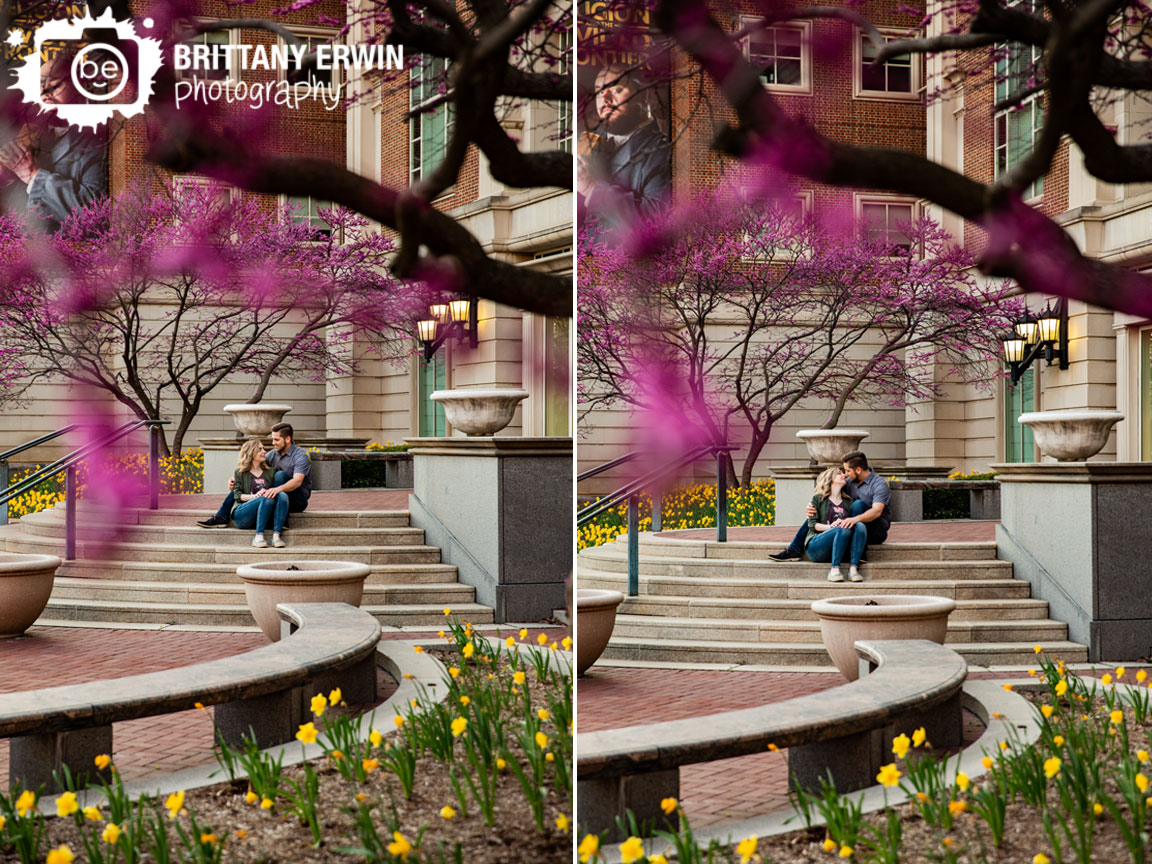 Indianapolis-engagement-portrait-photographer-couple-on-steps-of-indiana-historical-society-redbud-blooming-spring-trees.jpg