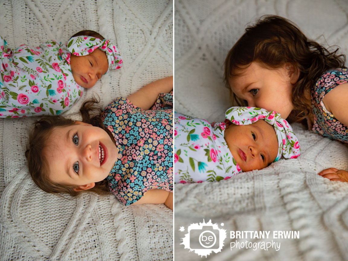 Indianapolis-portrait-photographer-big-sister-with-newborn-baby-girl-flower-dress-wrap.jpg