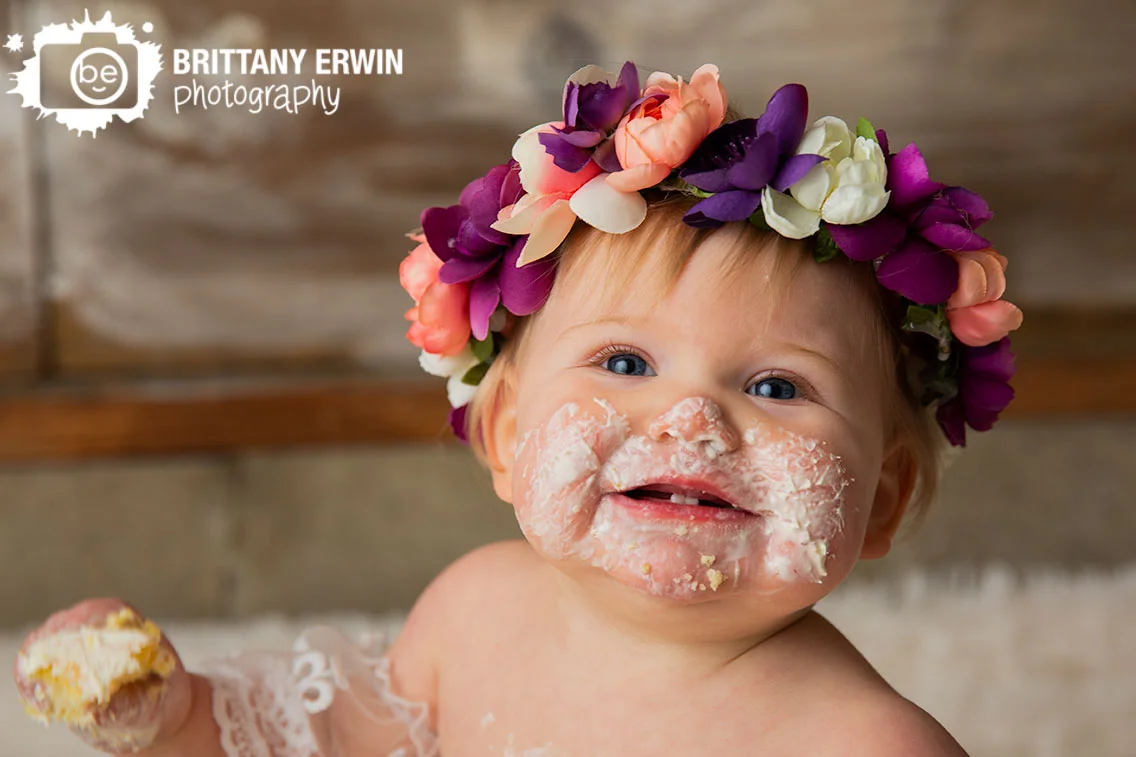 Indianapolis-portrait-photographer-cake-smash-icing-happy-girl-flower-crown-studio.jpg