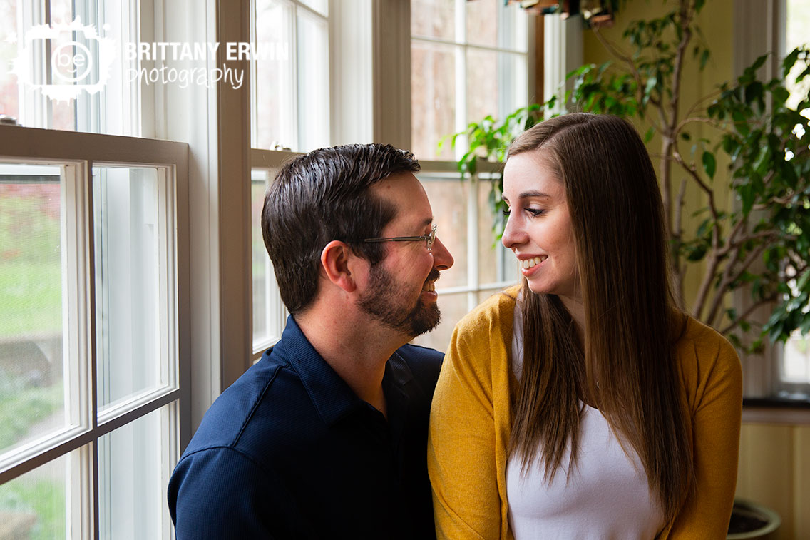 Engagement-portrait-couple-in-window-seat-antique-historic-home-blanton-house-Danville.jpg