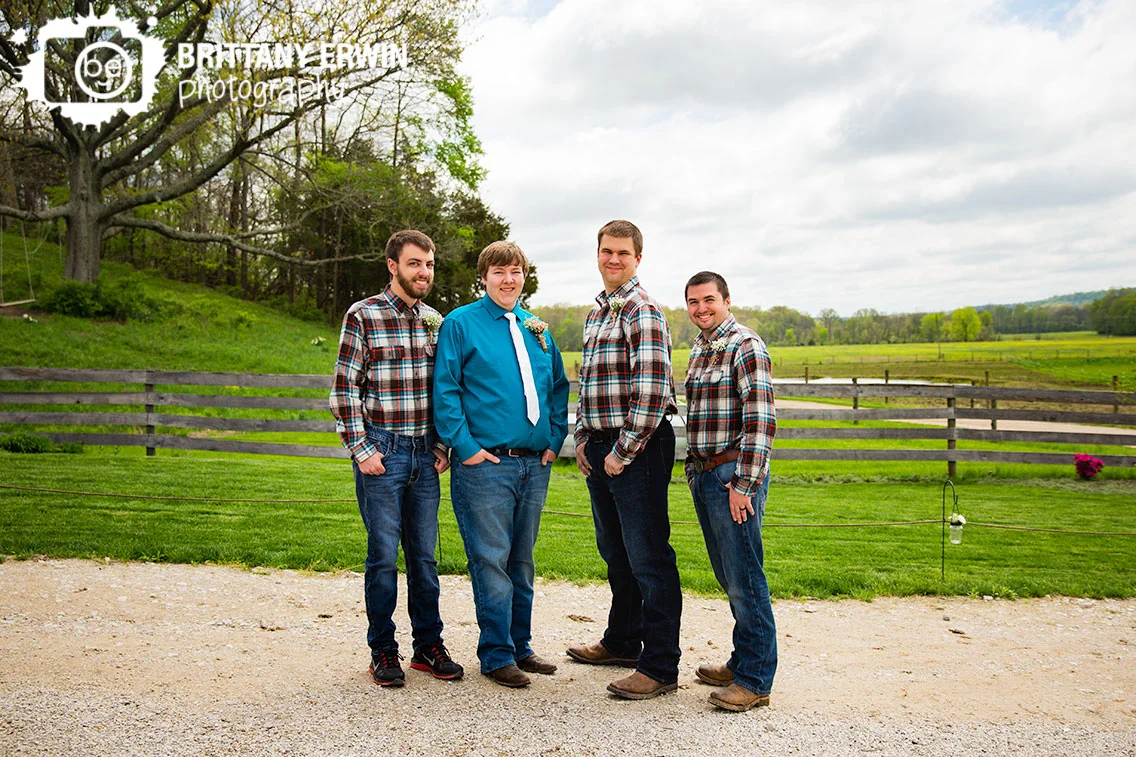 Groomsmen-portrait-with-groom-outside-rustic-gatherings-spring-wedding.jpg