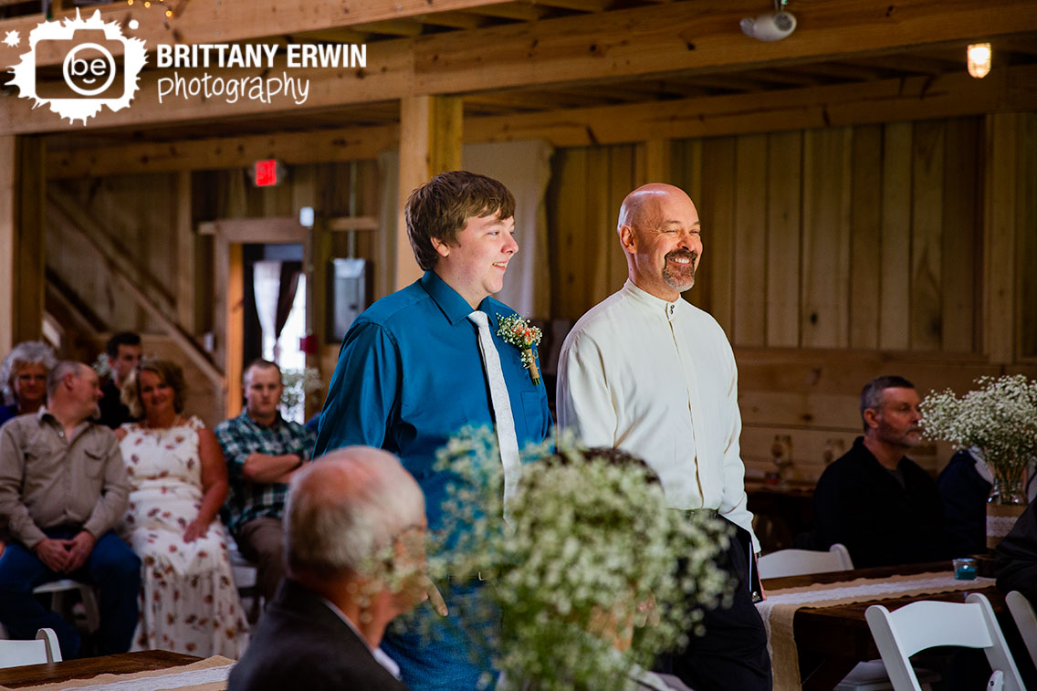 groom-walking-down-aisle-with-officiant-rustic-gatherings-llc.jpg