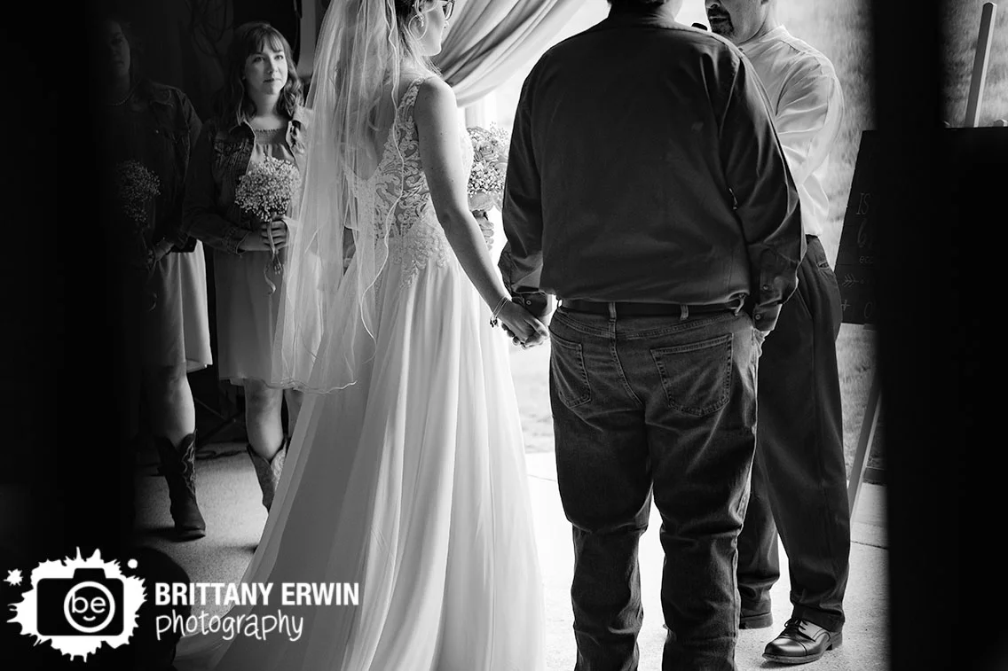 Indiana-wedding-photographer-bride-groom-holding-hands-ceremony.jpg