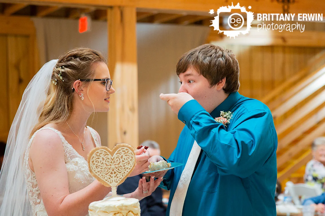 Wedding-photographer-rustic-gatherings-llc-cake-cutting-couple-groom-ate-first.jpg