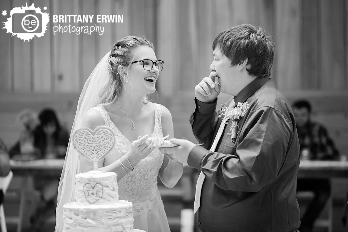 Rustic-Gatherings-LLC-wedding-barn-venue-cake-cutting-laugh-funny.jpg