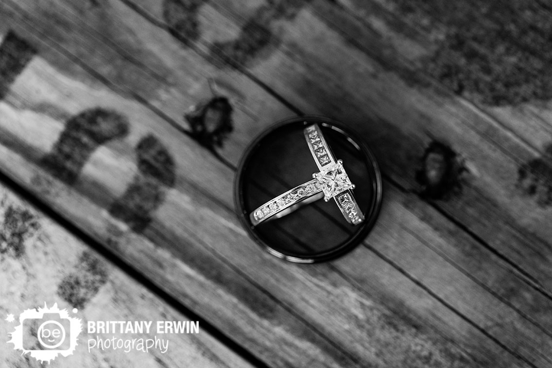 bride-rings-enagement-wedding-band-resting-inside-groom-ring.jpg