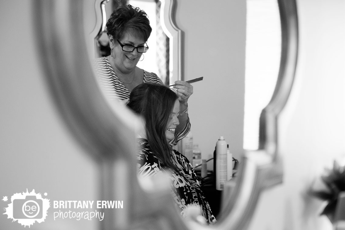 wedding-photographer-bride-having-hair-done-in-mirror.jpg